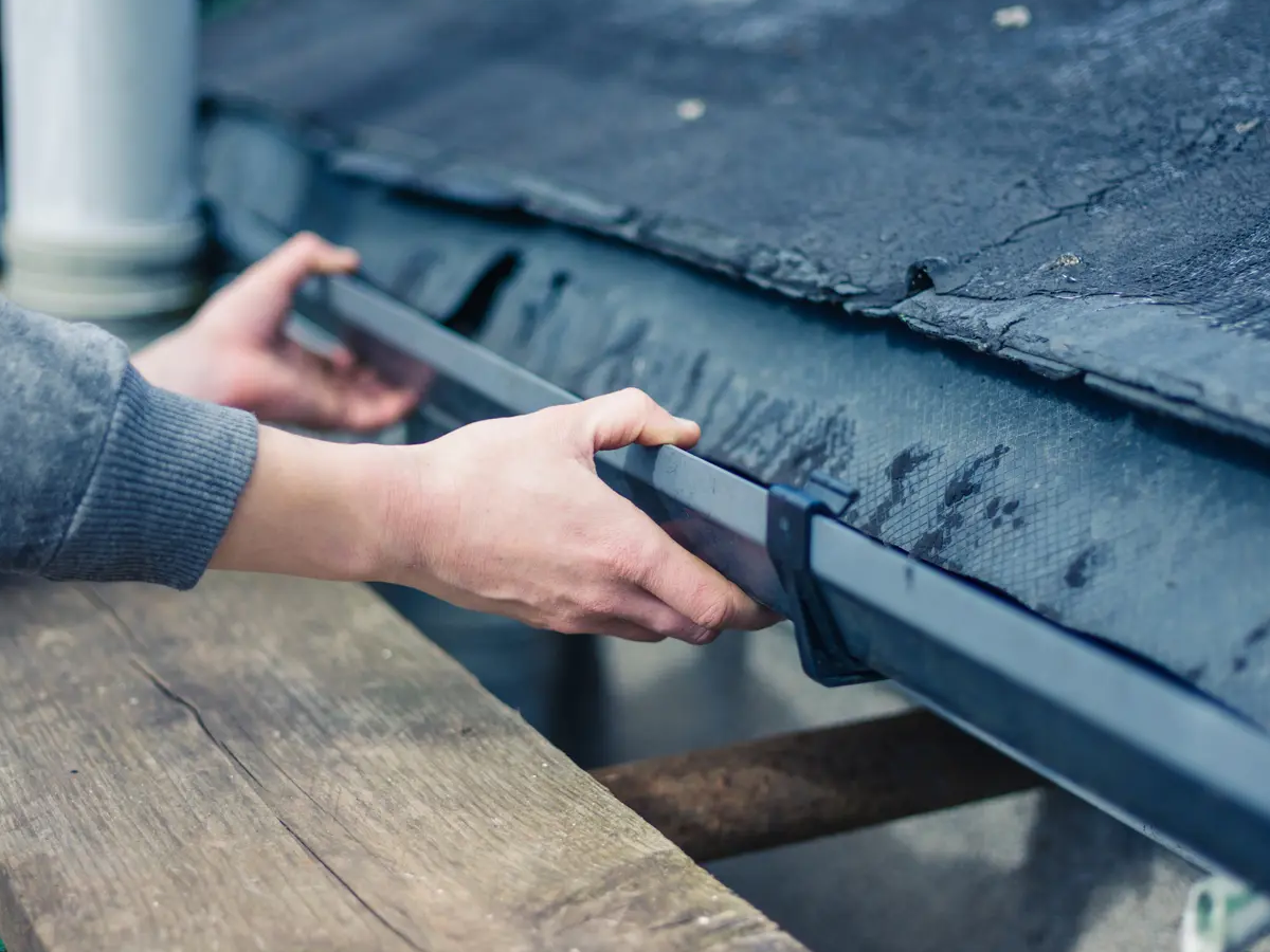 Professional Gutter Repair Services London & Surrey Professional gutter repair service in London and Surrey - Expert technicians repairing damaged and leaking gutters